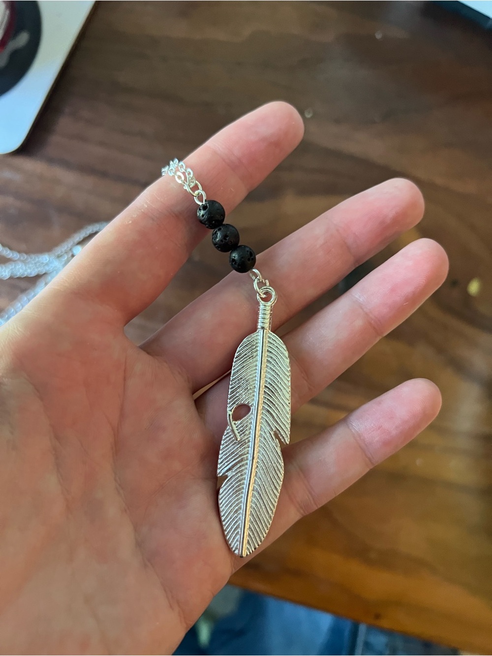 Silver Feather Pendant Necklace with Black Lava Beads